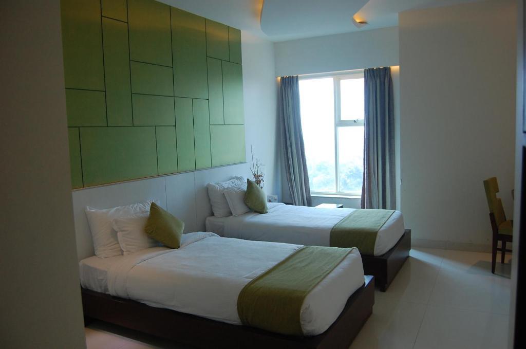 Rose Valley Orbit Hotel Силигури Номер фото